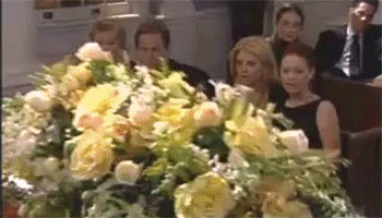 man rising out of coffin